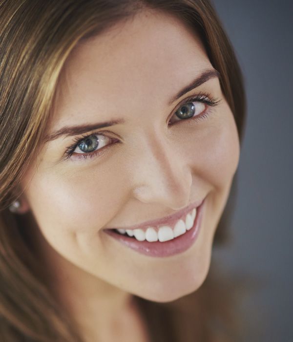 Photo of woman smiling while looking up
