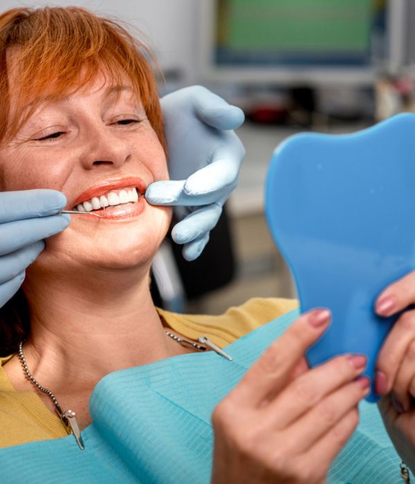 woman smiling in the dentist's chair